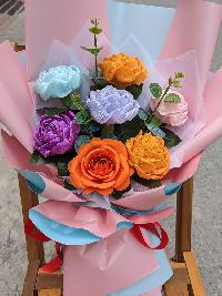 Bó hoa giấy nhún 7 bông màu mix giấy gói hồng