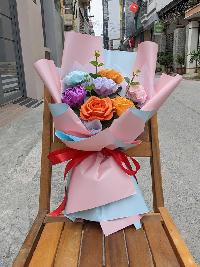 Bó hoa giấy nhún 7 bông màu mix giấy gói hồng