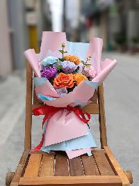 Bó hoa giấy nhún 7 bông màu mix giấy gói hồng